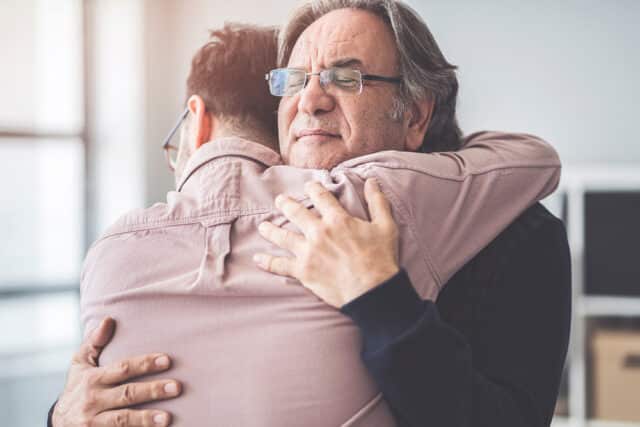 opioid abuse drug detox treatment program father and son hugging
