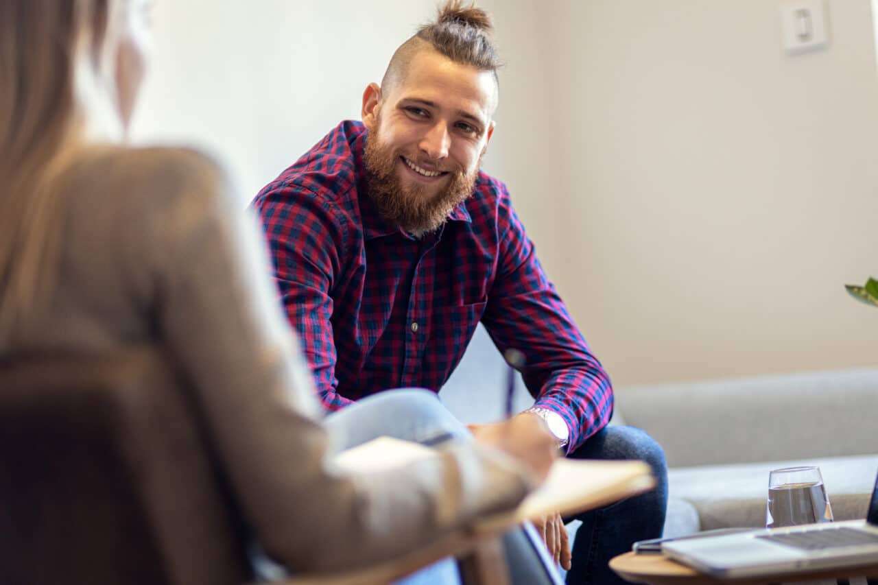 young man in counseling session for alcohol addiction