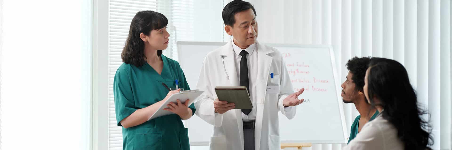 doctors speaking with patient